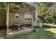 Backyard patio with pergola, table, and chairs at 1001 Yopon Ct, Raleigh, NC 27603
