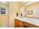 Bathroom with single vanity, mirror, and built in storage at 1001 Yopon Ct, Raleigh, NC 27603