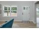 Bright entryway with a white door and wood-look floors at 217 Temple Ave, Sanford, NC 27330