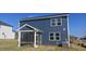 Two-story home with navy siding and screened porch at 19 Longdale Dr, Graham, NC 27253