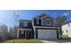 Two story home with gray and navy siding at 19 Longdale Dr, Graham, NC 27253
