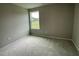 Spacious bedroom with carpet flooring and a large window at 749 Sherrill Farm Dr, Benson, NC 27504