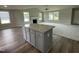 Kitchen island with granite countertop and hardwood floors at 749 Sherrill Farm Dr, Benson, NC 27504
