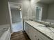 Double vanity bathroom with granite countertop and soaking tub at 749 Sherrill Farm Dr, Benson, NC 27504