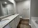 Double vanity bathroom with granite countertop and flooring at 749 Sherrill Farm Dr, Benson, NC 27504