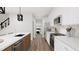 Modern kitchen with stainless steel appliances and hardwood floors at 4038 Elk Creek Ln # 60, Raleigh, NC 27612