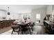 Bright dining area with wooden table and access to patio at 4038 Elk Creek Ln # 60, Raleigh, NC 27612