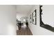 Bright hallway with modern artwork and hardwood floors at 4038 Elk Creek Ln # 60, Raleigh, NC 27612