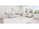 Spacious living room with comfortable sofa and large windows at 4038 Elk Creek Ln # 60, Raleigh, NC 27612