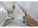 Elegant curved staircase with wrought iron railing at 3319 White Oak Rd, Raleigh, NC 27609