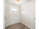 Bright entryway with wood-look flooring and a white door at 1109 Pale Moss Dr, Durham, NC 27704