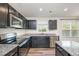 Modern kitchen with stainless steel appliances and granite counters at 1109 Pale Moss Dr, Durham, NC 27704