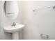 Clean bathroom with pedestal sink, shower, and toilet at 1109 Pale Moss Dr, Durham, NC 27704