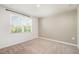 Well-lit bedroom with neutral wall and carpet at 1109 Pale Moss Dr, Durham, NC 27704