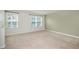 Bright bedroom with neutral walls and carpet at 1109 Pale Moss Dr, Durham, NC 27704