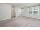 Spacious bedroom featuring neutral walls and carpet at 1109 Pale Moss Dr, Durham, NC 27704