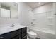 Modern bathroom with dark vanity and tub/shower combo at 1109 Pale Moss Dr, Durham, NC 27704