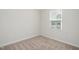 Simple bedroom with neutral walls and carpet at 1109 Pale Moss Dr, Durham, NC 27704
