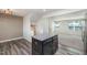 Kitchen island with granite countertop and dark cabinets at 1109 Pale Moss Dr, Durham, NC 27704