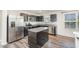 Modern kitchen with stainless steel appliances and granite counters at 1109 Pale Moss Dr, Durham, NC 27704