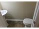 Powder room with pedestal sink and toilet at 4327 Mantua Way, Raleigh, NC 27604