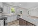 Modern kitchen with island and stainless steel appliances at 165 Brookhaven Dr, Spring Hope, NC 27882