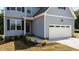 Gray house exterior with white garage door and landscaping at 165 Brookhaven Dr, Spring Hope, NC 27882