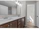 Double vanity bathroom with modern fixtures and a separate toilet area at 165 Brookhaven Dr, Spring Hope, NC 27882