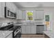 Modern kitchen with stainless steel appliances and granite countertops at 165 Brookhaven Dr, Spring Hope, NC 27882