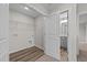 Laundry room with built in shelving and adjacent bathroom at 165 Brookhaven Dr, Spring Hope, NC 27882