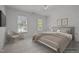 Charming bedroom with a queen bed and ample natural light at 111 N Coslett Ct, Cary, NC 27513