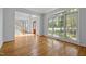 Sunlit living area with hardwood floors and large windows at 111 N Coslett Ct, Cary, NC 27513