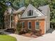 Brick home with a large front yard and attached garage at 111 N Coslett Ct, Cary, NC 27513