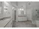 Spa-like bathroom featuring a double vanity and walk-in shower at 111 N Coslett Ct, Cary, NC 27513