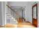 Bright entryway with hardwood floors and a staircase at 111 N Coslett Ct, Cary, NC 27513
