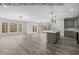 Open concept dining area with hardwood floors and lots of natural light at 102 Mayan Dr, Louisburg, NC 27549