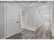Bright hallway with light gray walls and wood-look flooring at 102 Mayan Dr, Louisburg, NC 27549