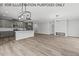 Modern kitchen with gray cabinets, white countertops, and an island at 102 Mayan Dr, Louisburg, NC 27549