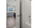 Guest bathroom with a tub shower combination and kitchen view at 63 Falls River Ct, Broadway, NC 27505