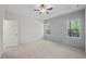 Spacious bedroom with carpet flooring and ceiling fan at 63 Falls River Ct, Broadway, NC 27505