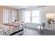Charming bedroom with floral bedding and ample natural light at 616 Beaminster Pl, Fuquay Varina, NC 27526