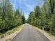 Paved walking trail through lush green trees at 4929 Trout Crest Court, Raleigh, NC 27604
