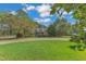 Brick home with circular driveway and lush landscaping at 1100 Branch Chapel Church Rd, Selma, NC 27576