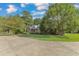 Brick home with circular driveway and neatly landscaped yard at 1100 Branch Chapel Church Rd, Selma, NC 27576