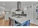 Modern kitchen with white cabinets, stainless steel appliances, and a large island at 1100 Branch Chapel Church Rd, Selma, NC 27576