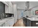 Modern kitchen with white cabinets, quartz countertops, and stainless steel appliances at 1100 Branch Chapel Church Rd, Selma, NC 27576