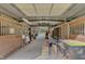 Long view of barn aisle with multiple horse stalls at 1100 Branch Chapel Church Rd, Selma, NC 27576