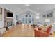 Open living room with hardwood floors, vaulted ceiling, and fireplace at 1100 Branch Chapel Church Rd, Selma, NC 27576