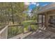 Wooden deck overlooking fenced pasture and trees at 1100 Branch Chapel Church Rd, Selma, NC 27576