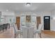 Bright dining room features a glass table, four chairs, and access to the kitchen at 1100 Branch Chapel Church Rd, Selma, NC 27576